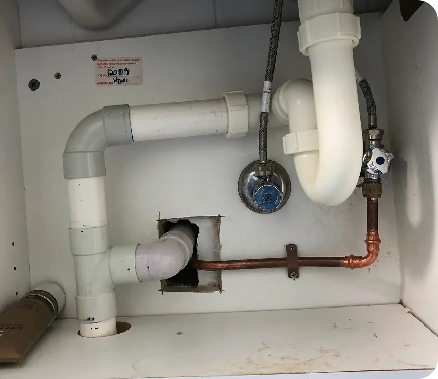 Emergency plumber in Hornsby repairing under-sink plumbing